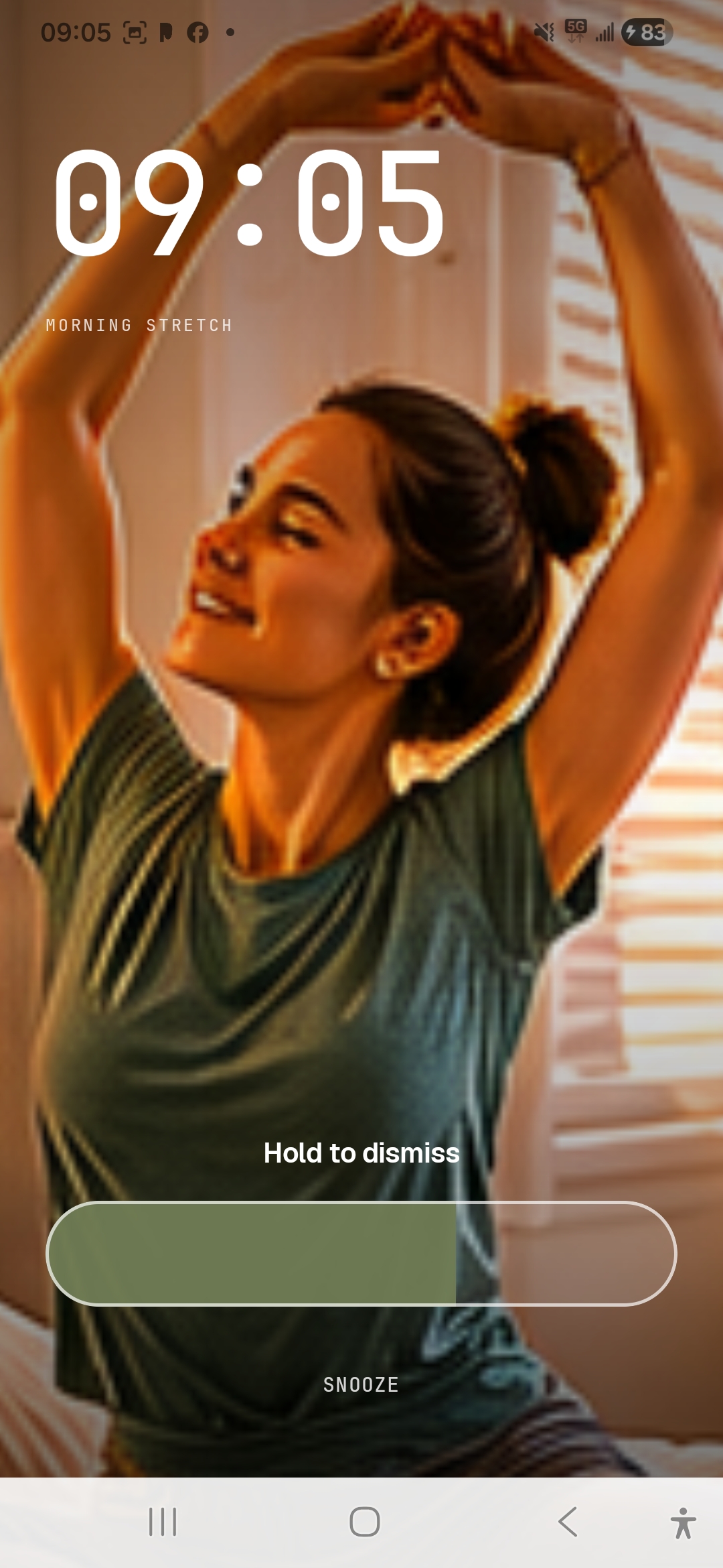 Picolarm alarm screen showing a full-screen photo, alarm time, hold to dismiss, and snooze.